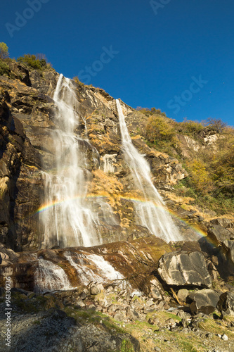 Beautiful waterfall in the forest with rainbow