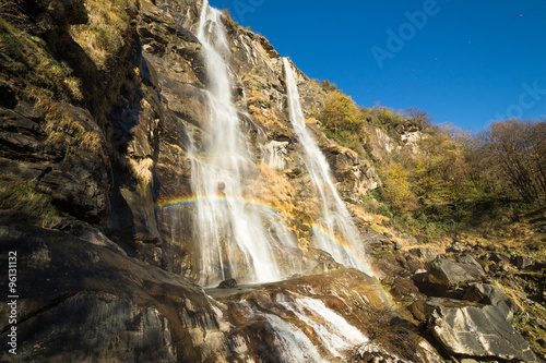 Beautiful waterfall in the forest with rainbow