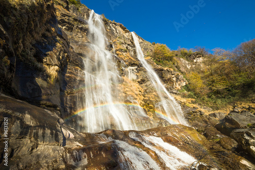 Beautiful waterfall in the forest with rainbow
