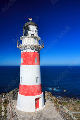 White and red striped lighthouse, location - Cape Palliser bay l