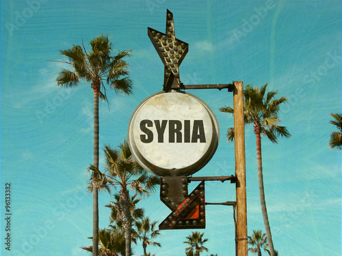 aged and worn vintage photo of syria sign with palm trees