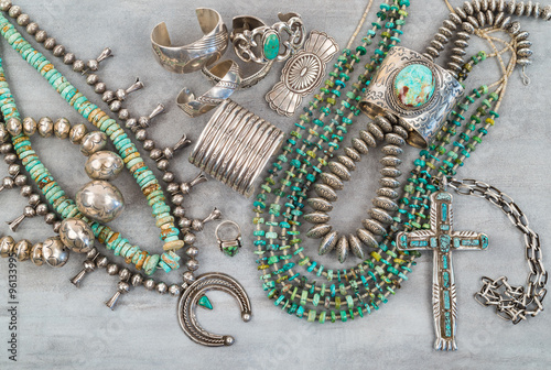 A collection of Vintage Native American Jewelry made of Turquoise and Sterling Silver. Necklaces, cuff bracelets, Squash Blossom and a Silver Cross