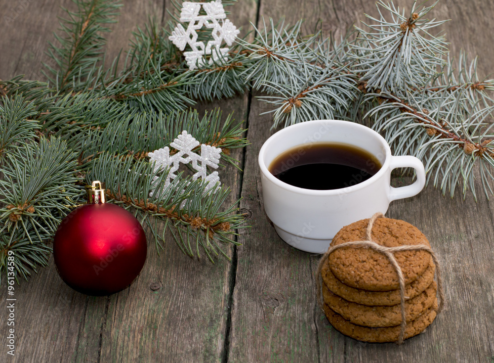 the fir-tree branches decorated with an ornament, coffee baking the fir-tree branches decorated with an ornament, coffee baking
