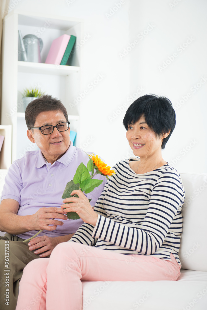 © wong yu liang - asian senior couple giving flower © wong yu liang - asian senior couple giving flower