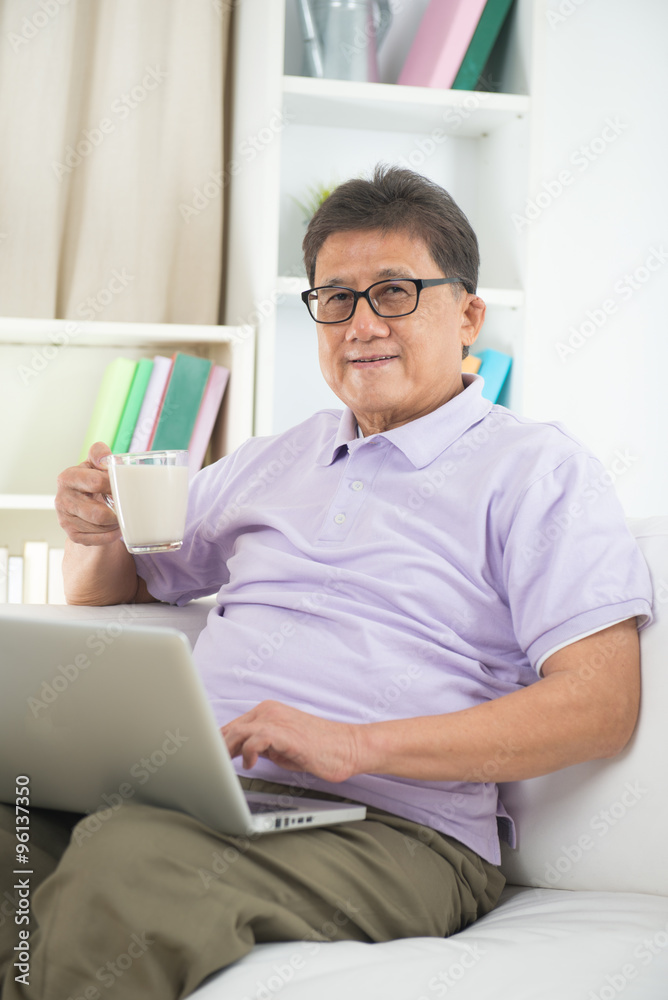 asian Senior Man Reading With Drink At Home asian Senior Man Reading With Drink At Home