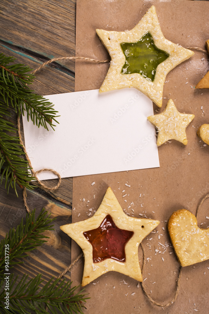 Homemade star shaped cookies. Tasty decorations for fir tree. Toned image