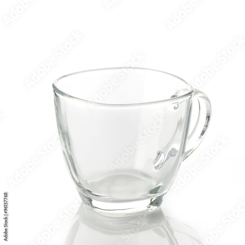 Tea cup made of transparent glass on white background shot in studio