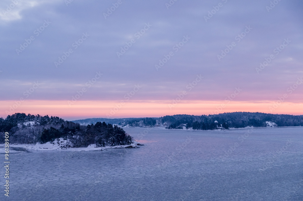 Skerries of Sweden covered by ice and snow on winter morning before sunrise Skerries of Sweden covered by ice and snow on winter morning before sunrise
