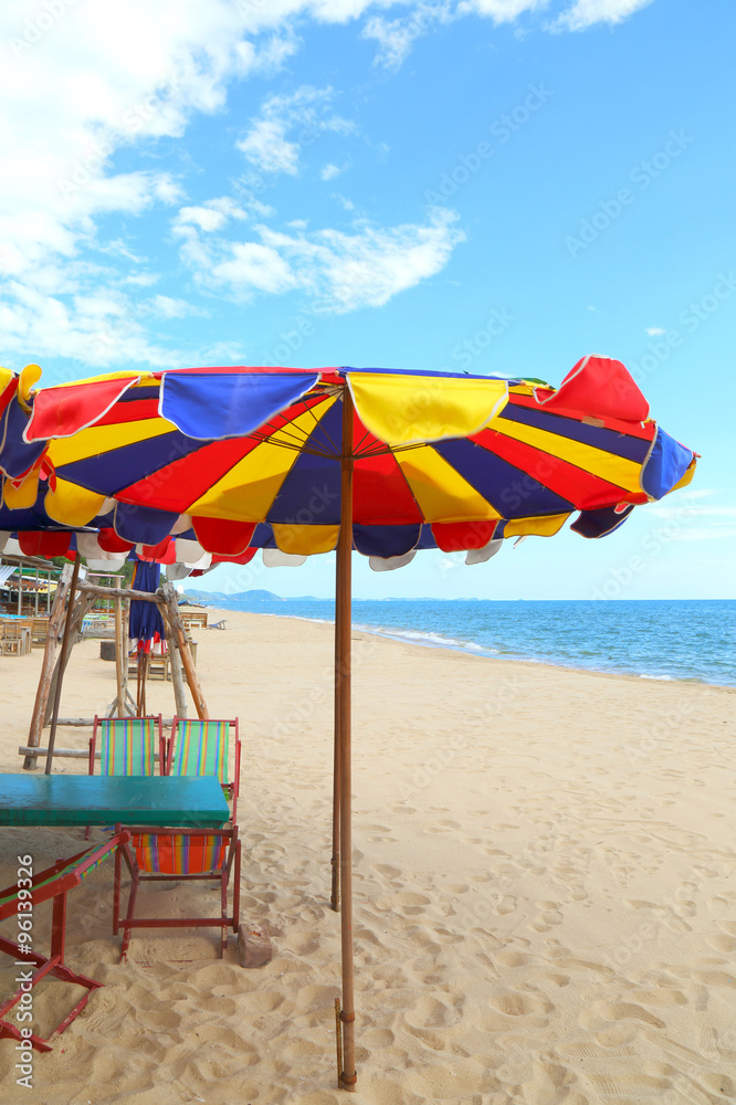 beach umbrella and beach under blue sky