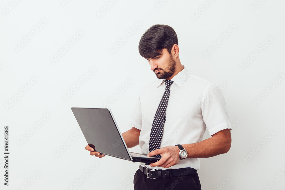 Portrait of an handsome businessman with a laptop Portrait of an handsome businessman with a laptop