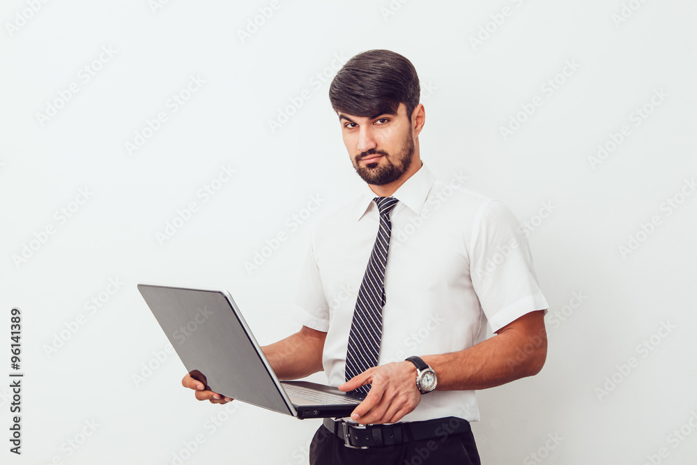 Portrait of an handsome businessman with a laptop Portrait of an handsome businessman with a laptop