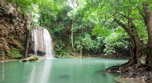 Fototapeta Naklejka Na Ścianę i Meble -  Deep forest waterfall at Erawan waterfall National Park Kanchana