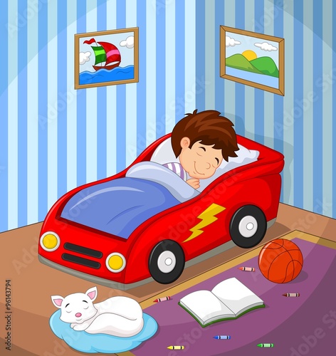 The boy was asleep in the car bed
