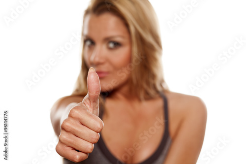 Young blonde showing thumbs up photo