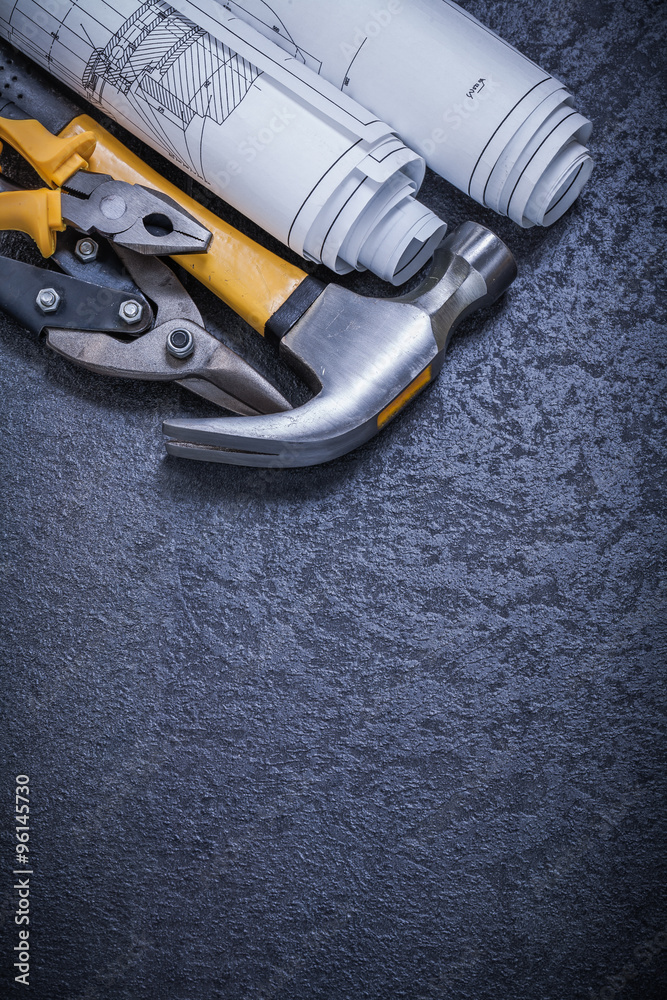 Construction drawings tin snips pliers claw hammer on black back Construction drawings tin snips pliers claw hammer on black back
