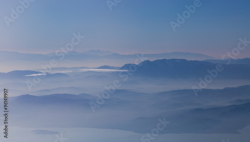 Amazing landscape of mountains weltered in mist