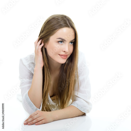 Young beautiful tender woman posing against white background. St