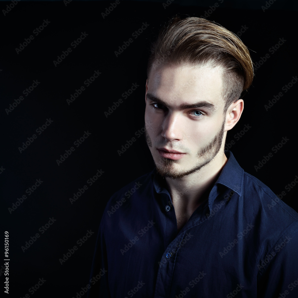 Portrait of beautiful charming young man with blue eyes and fair Portrait of beautiful charming young man with blue eyes and fair