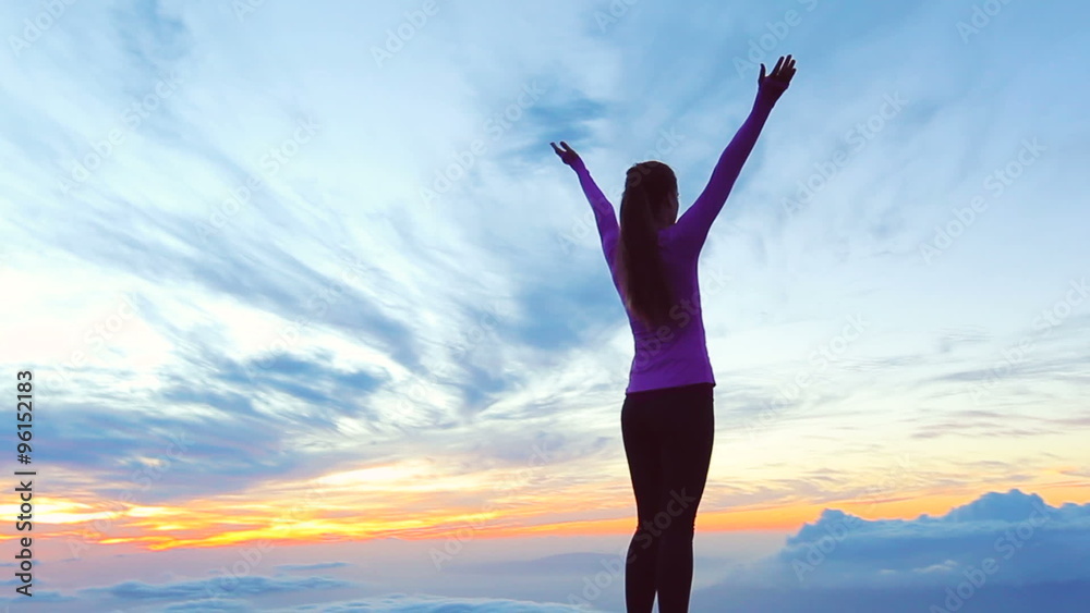 Reaching The Top. Happy successful fitness woman raising arms to the sky at sunset. Success, celebrating goals and achievement. Reaching The Top. Happy successful fitness woman raising arms to the sky at sunset. Success, celebrating goals and achievement.