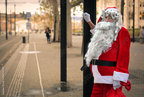 Santa Claus waiting at the bus station