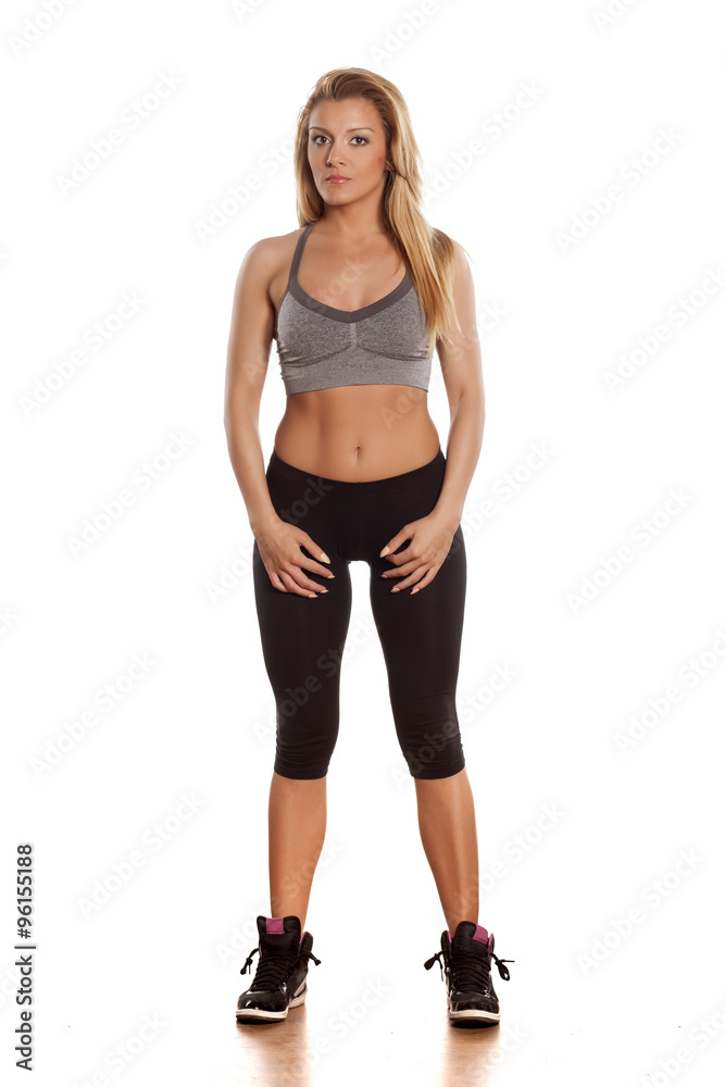 pretty athletic blonde posing in a studio on white pretty athletic blonde posing in a studio on white