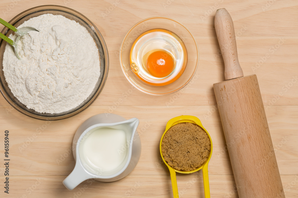 flour, egg, milk, sugar and rolling pin flour, egg, milk, sugar and rolling pin