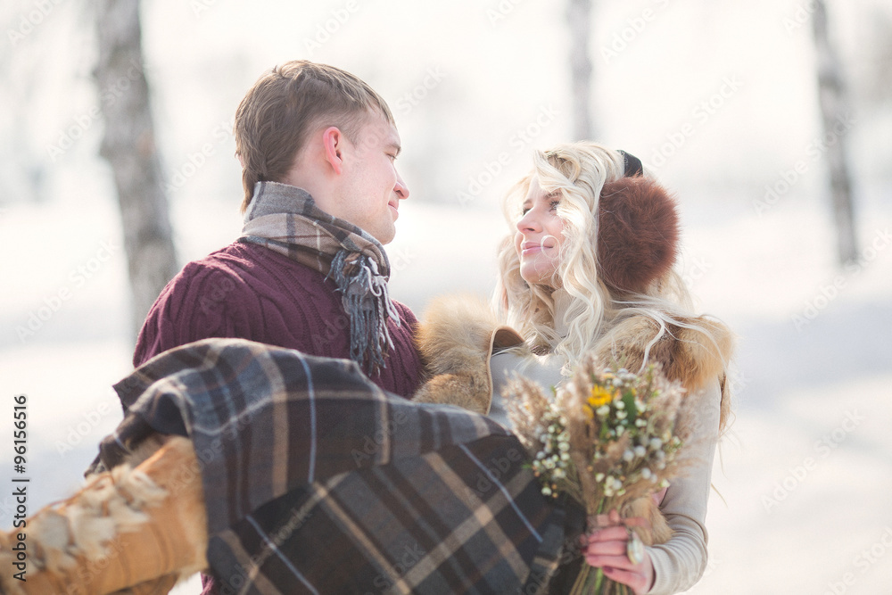 Happy Young Couple in Winter Park having fun Happy Young Couple in Winter Park having fun