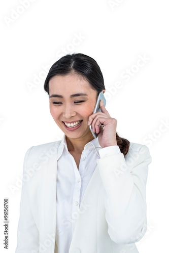 Smiling businesswoman using her smart phone