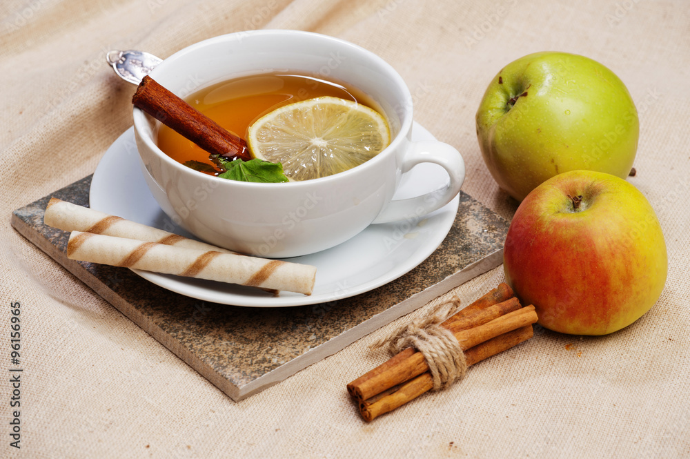 Tea with lemon, cinnamon sticks, tangerine Tea with lemon, cinnamon sticks, tangerine