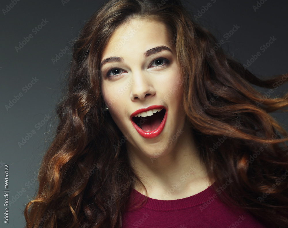 Young happy woman with wind in hair Young happy woman with wind in hair