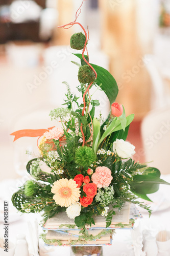 Fototapeta Naklejka Na Ścianę i Meble -  Flowers bouquet in vase on the table. Wedding decoration, decor. Holiday decoration flowers.