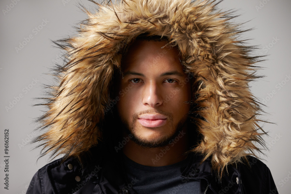 Studio Portrait Of Young Man Wearing Winter Coat Studio Portrait Of Young Man Wearing Winter Coat