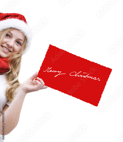 Mädchen mit Weihnachtsmütze und Weihnachtskarte