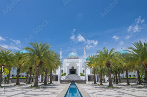 Wallpaper Mural The white of Mosque Albukhary located in Alor Star, state of Kedah, Malaysia with its fountain and squares in the foreground and blue sky with clouds in the background Torontodigital.ca
