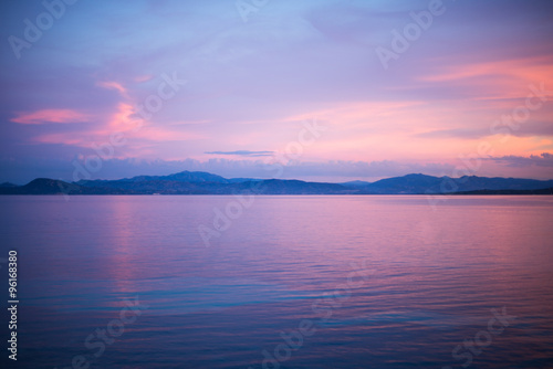 calm evening sunset scene at the water at Golfo Aranci, Sardinia, Italy