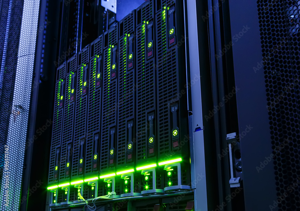 Foto rack with blade behind bars mainframe in the data center
