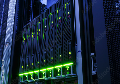 rack with blade behind bars mainframe in the data center