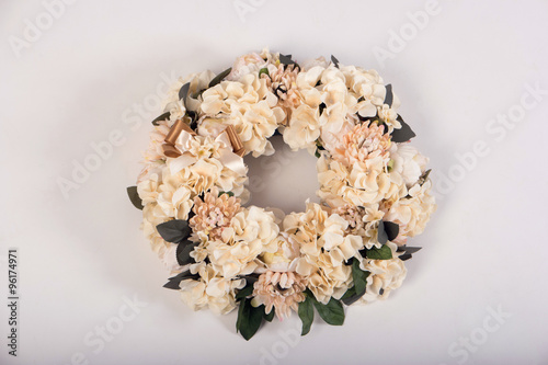 Artificial flowers wreath isolated on white