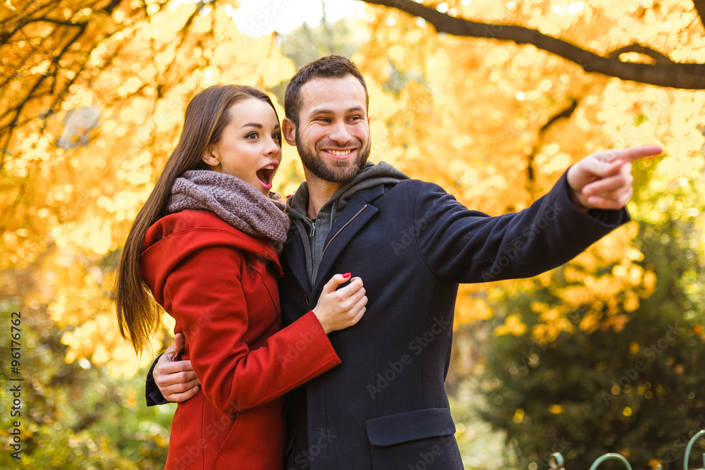 Nice concept for young couple in autumn park Nice concept for young couple in autumn park