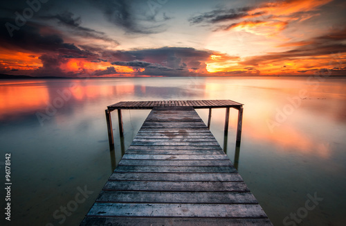 jetty and sunset with reflection © udoikel09
