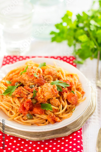 Pasta spaghetti with tuna, capers in tomato sauce