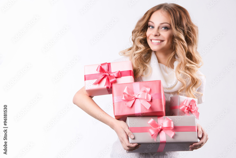 Beautiful smiling woman holding gift boxes. Beautiful smiling woman holding gift boxes.