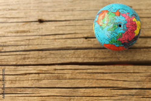 Close up of world globe - top view - travel destination and love different cultures concept - place for text