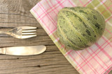 Melon,knife and fork - healthy eating concept