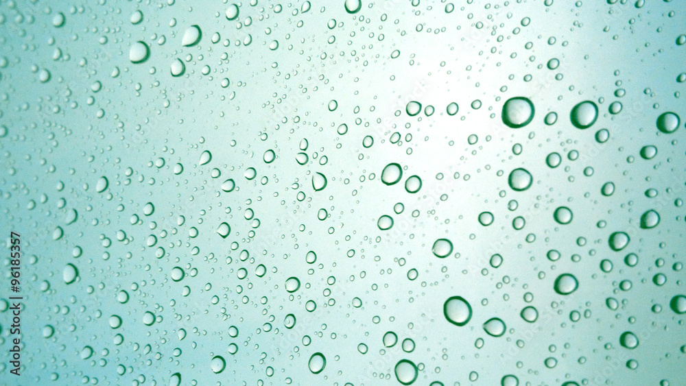 Close-up of water drops on glass surface as background