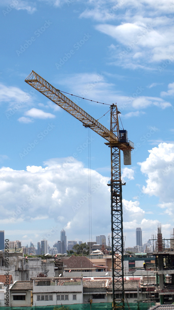 Industrial landscape with cranes on the blue sky Industrial landscape with cranes on the blue sky