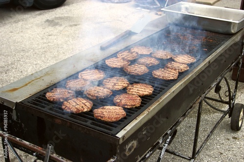 Burgers broiling on a large open grill