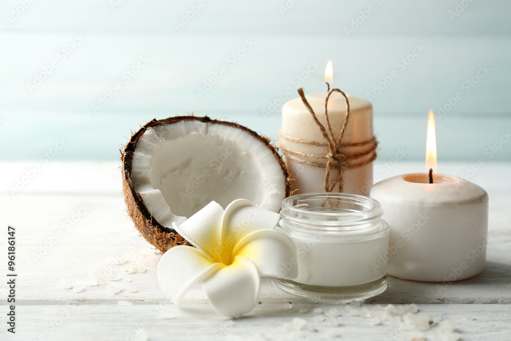 Spa coconut products on light wooden background Spa coconut products on light wooden background