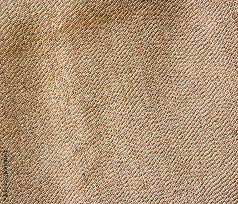 Fototapeta premium Old canvas, sackcloth. Vintage beige fabric texture, background.