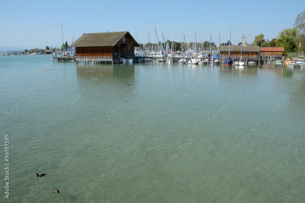 Pier, marina and buildings at Chiemsee lake in Germany